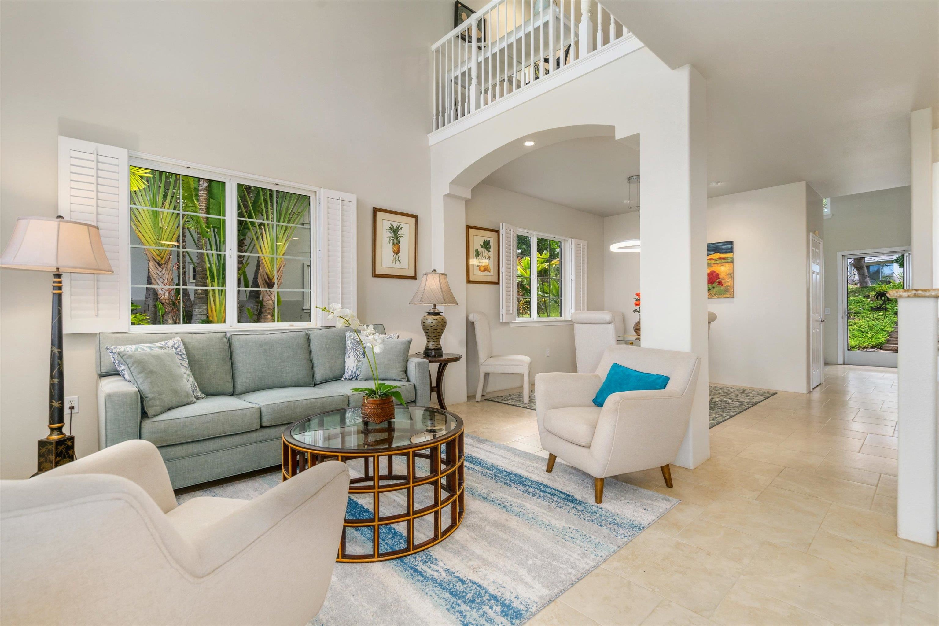 3950 Kalai Waa Street, Unit R 103 Kihei, HI 96753 - Photo 4 of 50 a living room with furniture and a large window