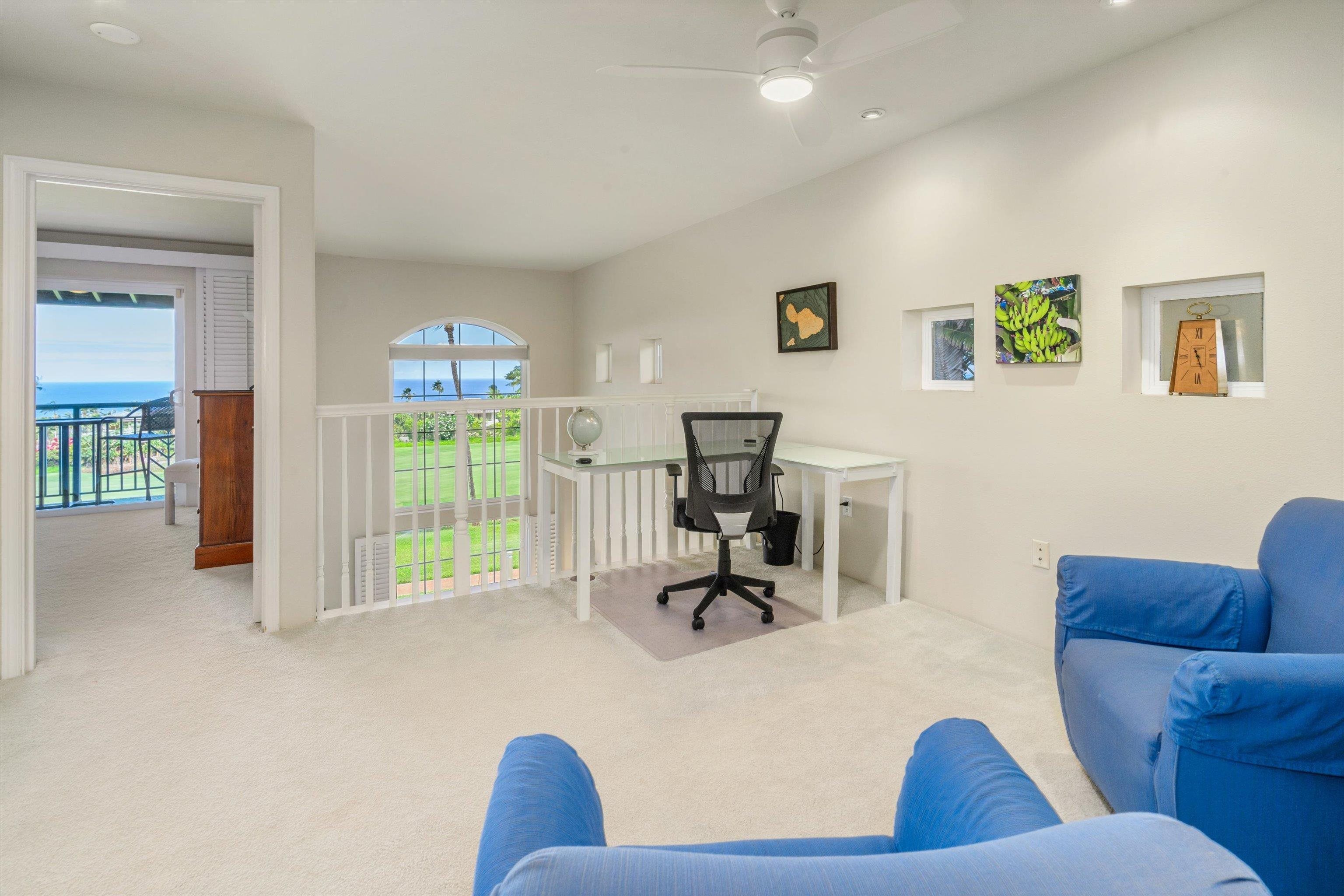 3950 Kalai Waa Street, Unit R 103 Kihei, HI 96753 - Photo 42 of 50 a living room with furniture and a flat screen tv