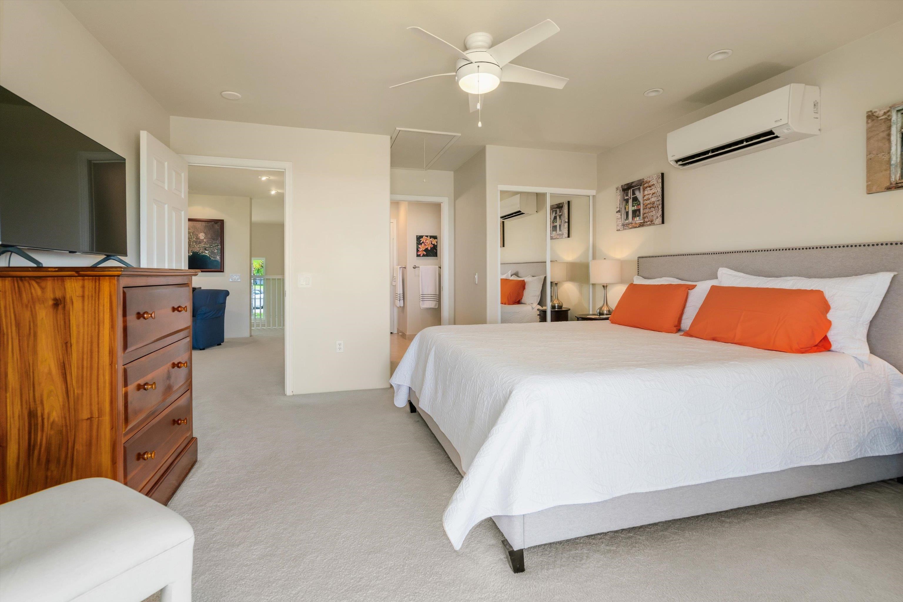 3950 Kalai Waa Street, Unit R 103 Kihei, HI 96753 - Photo 43 of 50 a bedroom with bed and flat tv screen on dresser
