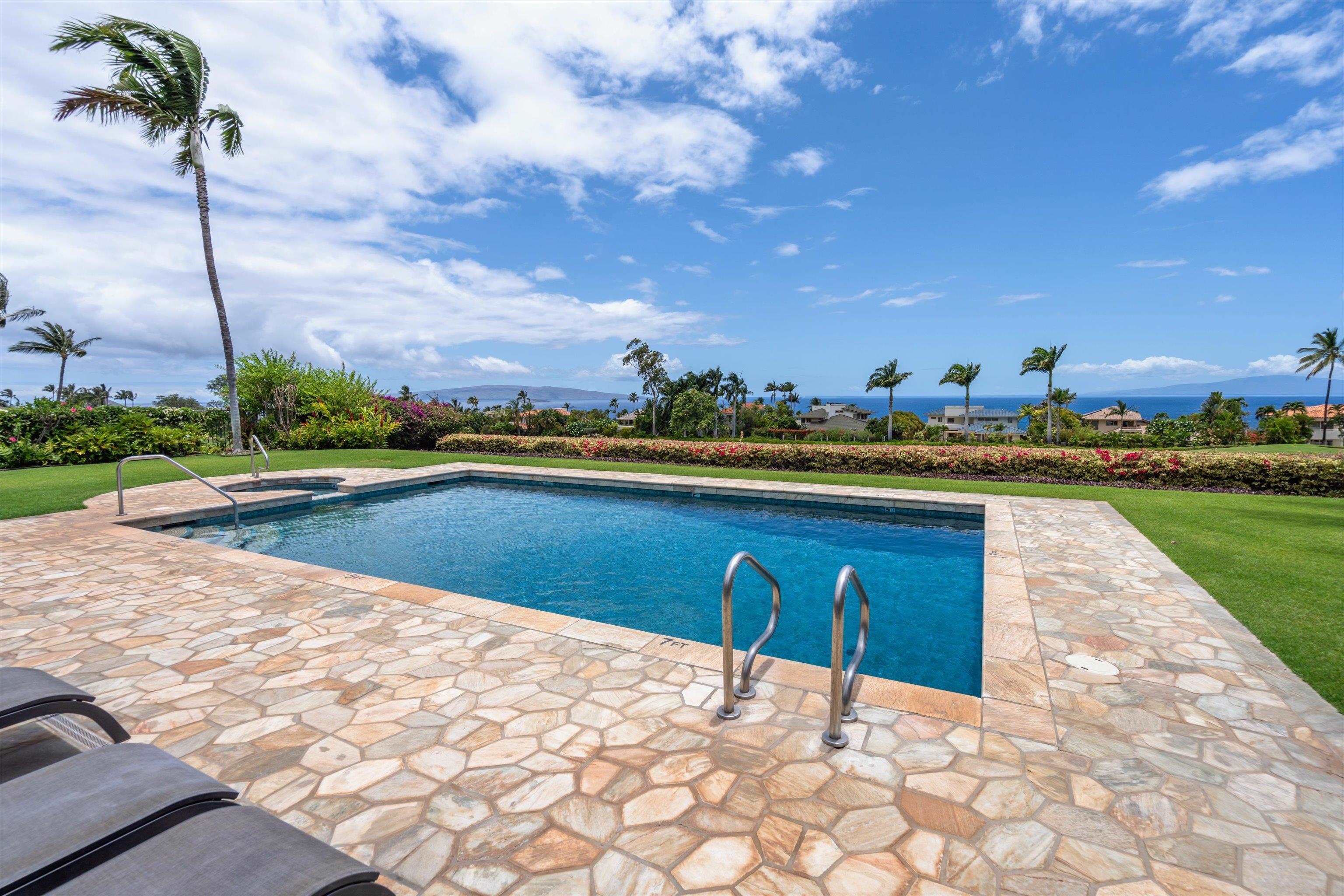 3950 Kalai Waa Street, Unit R 103 Kihei, HI 96753 - Photo 45 of 50 a view of a swimming pool and lounge chairs
