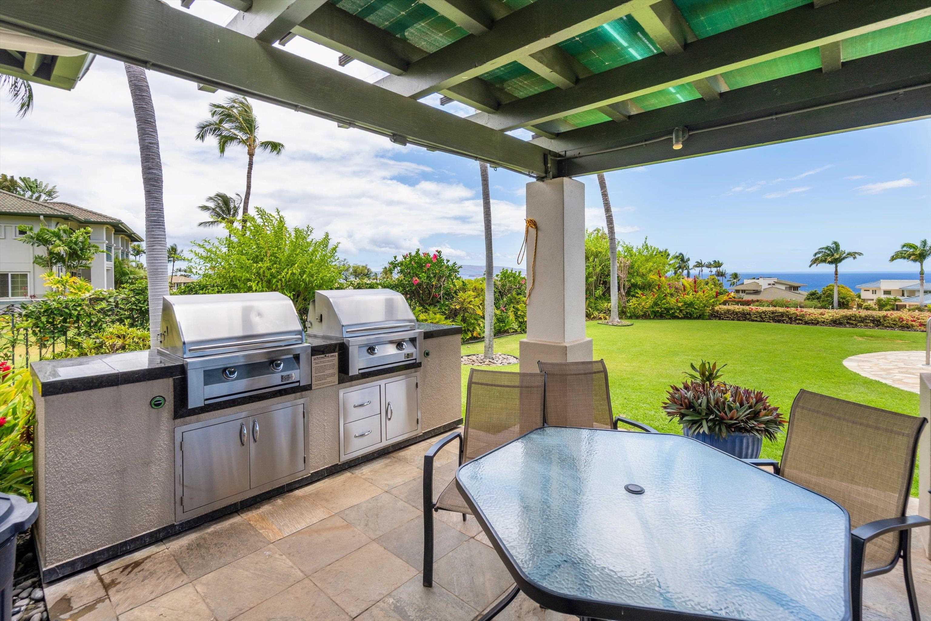 3950 Kalai Waa Street, Unit R 103 Kihei, HI 96753 - Photo 47 of 50 a outdoor space with chairs