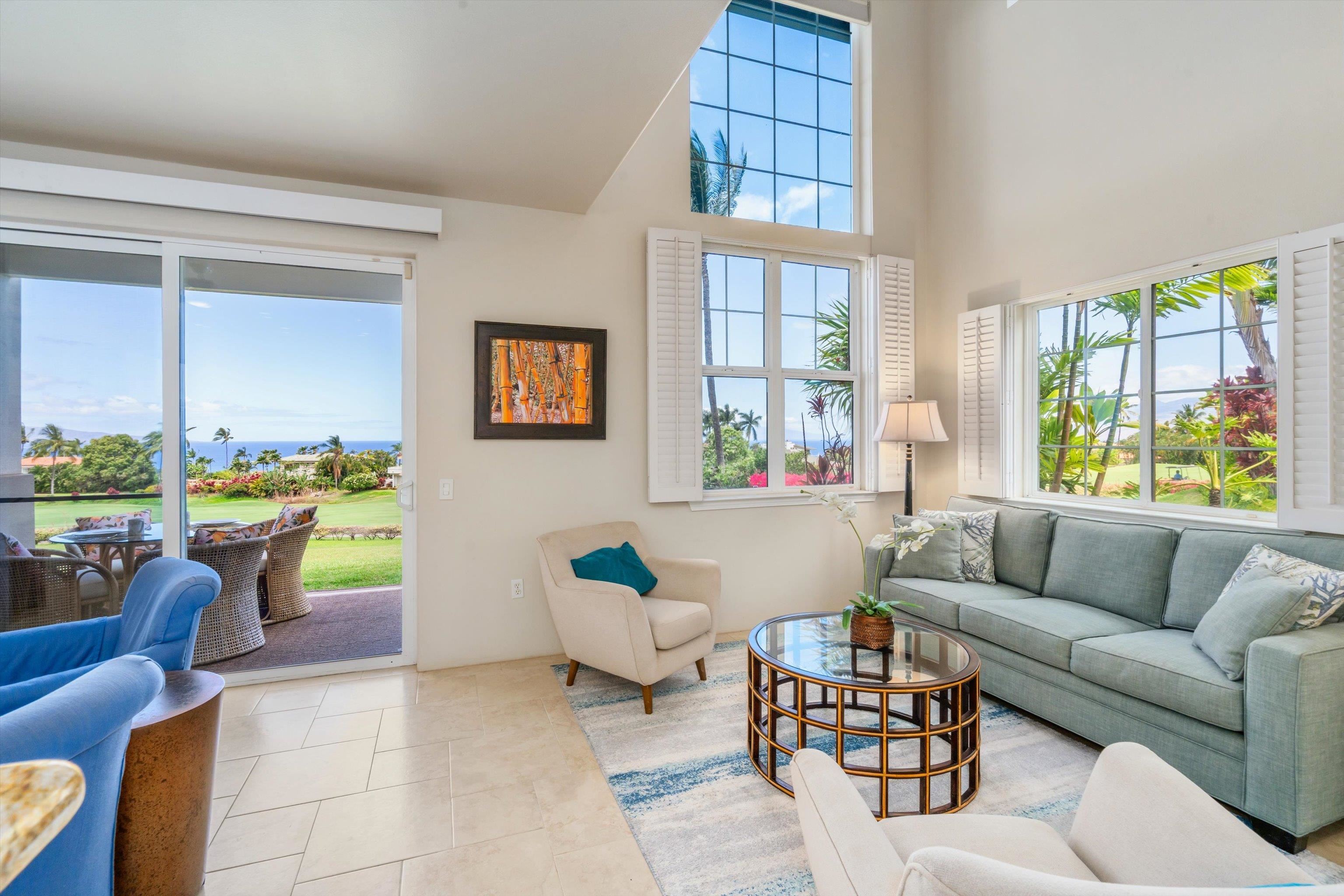 3950 Kalai Waa Street, Unit R 103 Kihei, HI 96753 - Photo 5 of 50 a living room filled with furniture and a large window