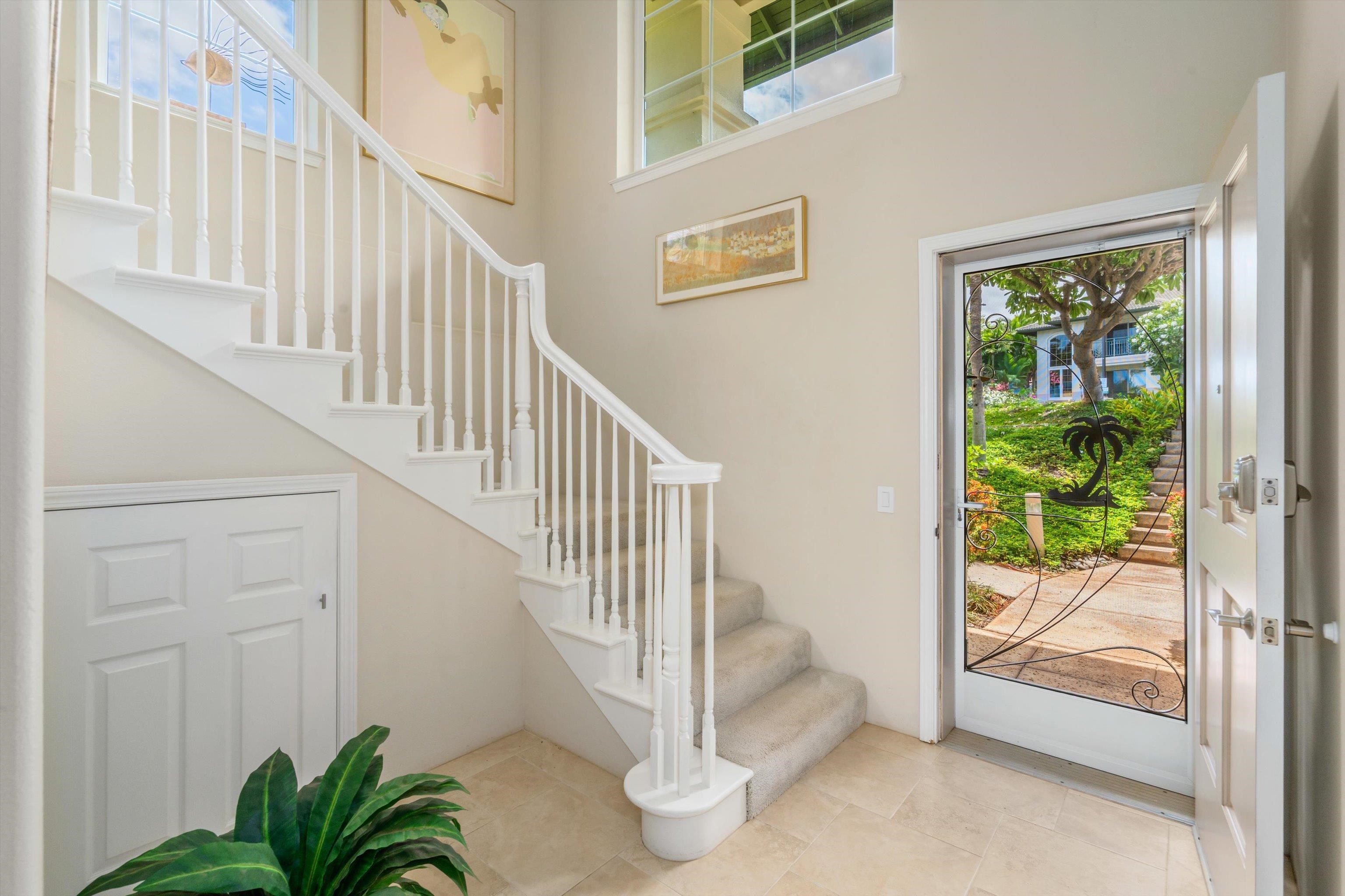 3950 Kalai Waa Street, Unit R 103 Kihei, HI 96753 - Photo 6 of 50 a view of entryway and hall with wooden floor