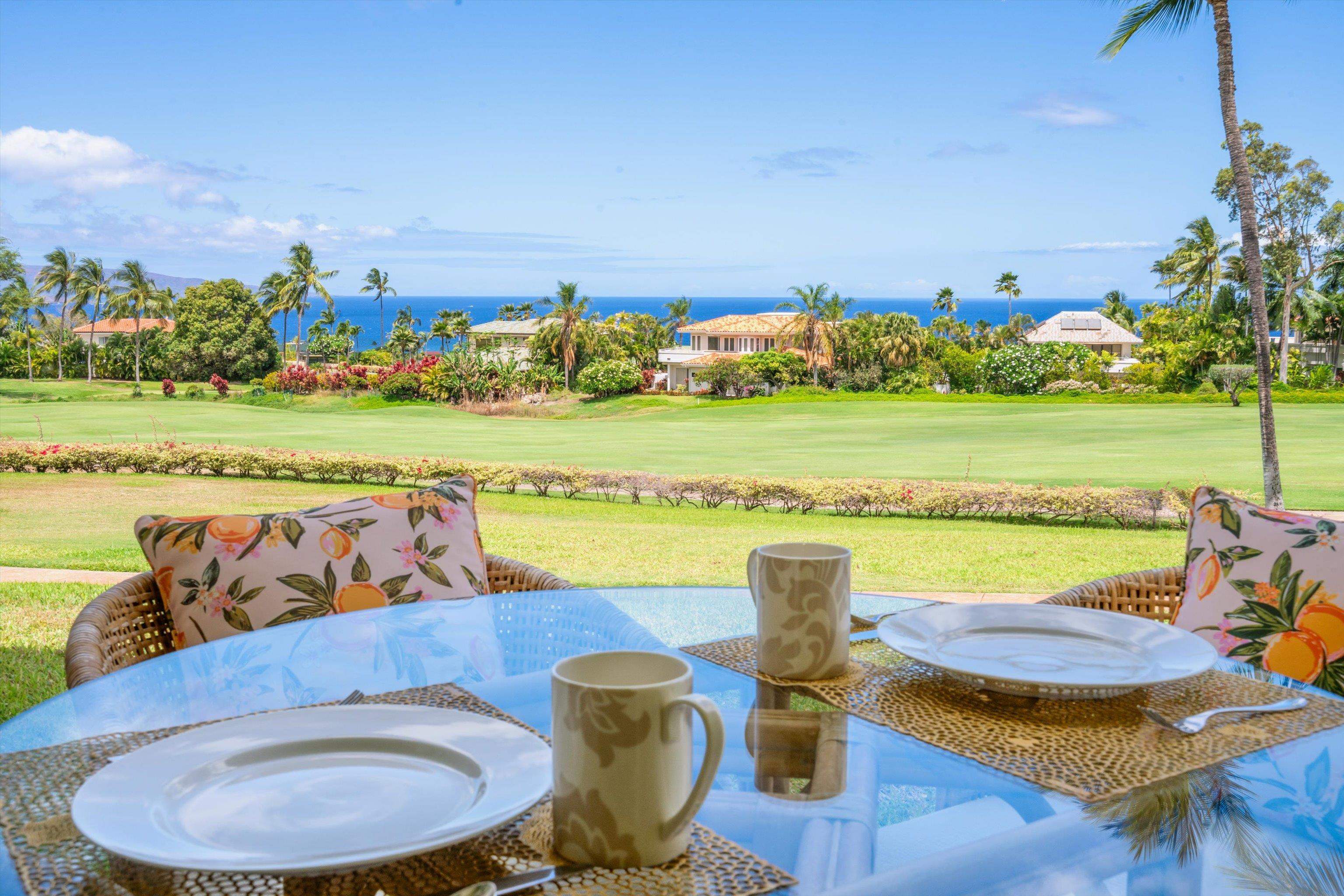 3950 Kalai Waa Street, Unit R 103 Kihei, HI 96753 - Photo 9 of 50 a view of a chairs and table on the terrace