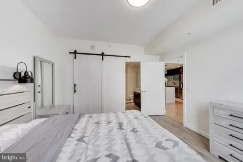 a bedroom with a bed and a dresser