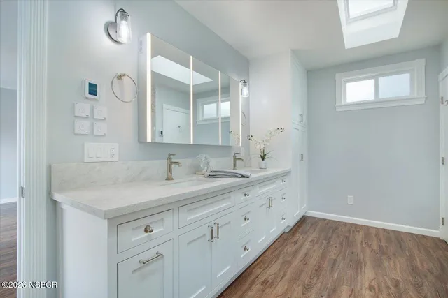 a bathroom with a sink and a mirror