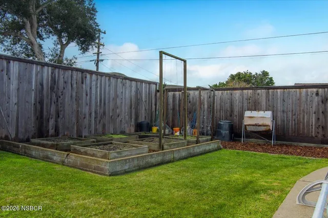 a view of a house with swimming pool and sitting area