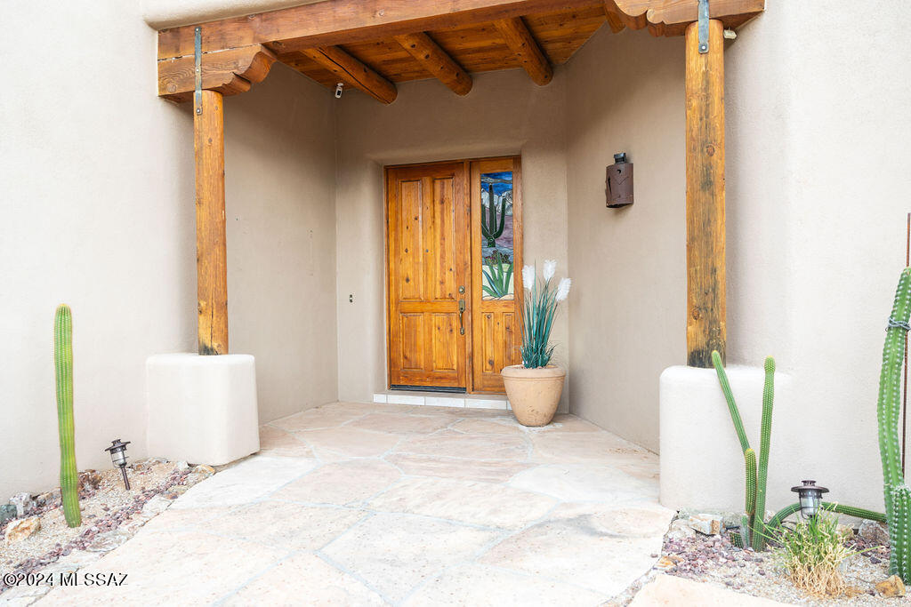 771 West Sedona Ridge Place Oro Valley, AZ 85755 - Photo 3 of 22 a view of an empty room with wooden floor and a window