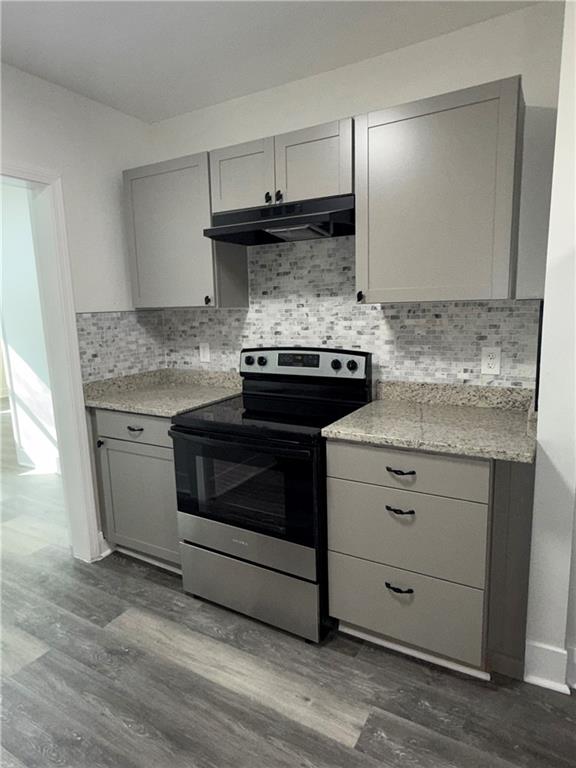 1418 East 10th Street West Point, GA 31833 - Photo 15 of 31 a kitchen with granite countertop a stove and a sink