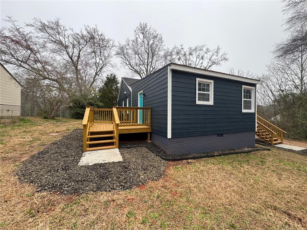 1418 East 10th Street West Point, GA 31833 - Photo 27 of 31 a view of a house with backyard