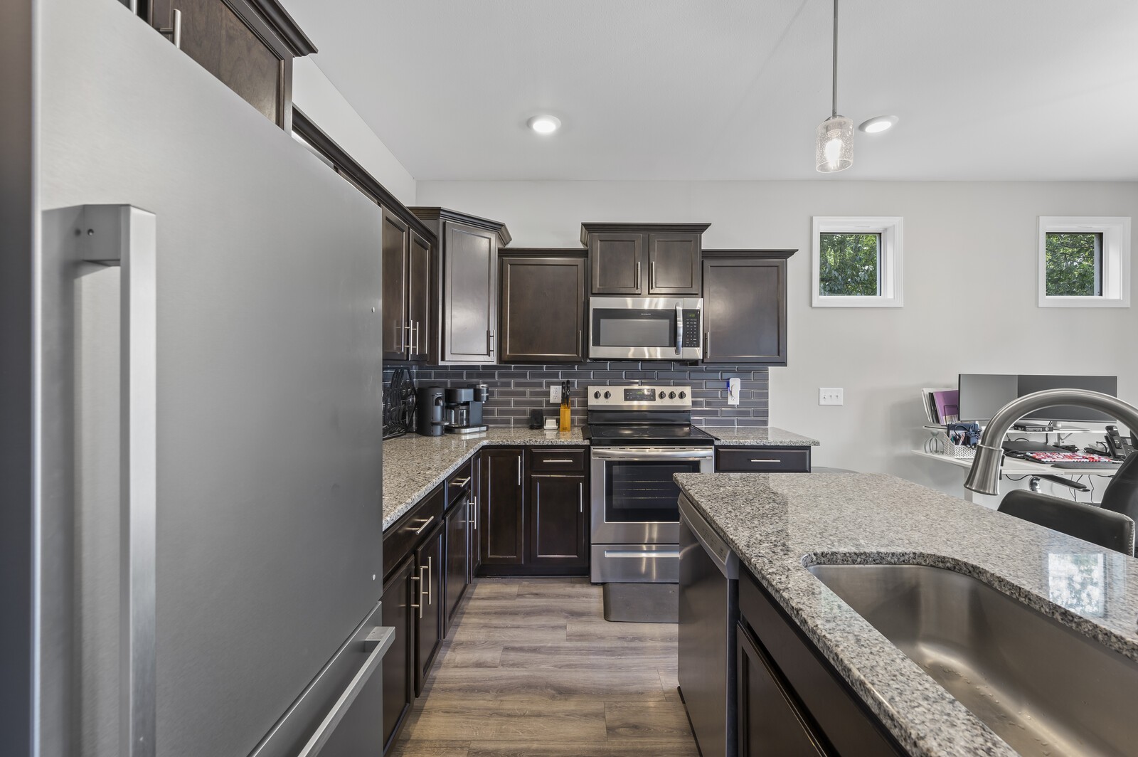 246 King Road Clarksville, TN 37042 - Photo 9 of 21 a kitchen with kitchen island granite countertop a sink stainless steel appliances and cabinets