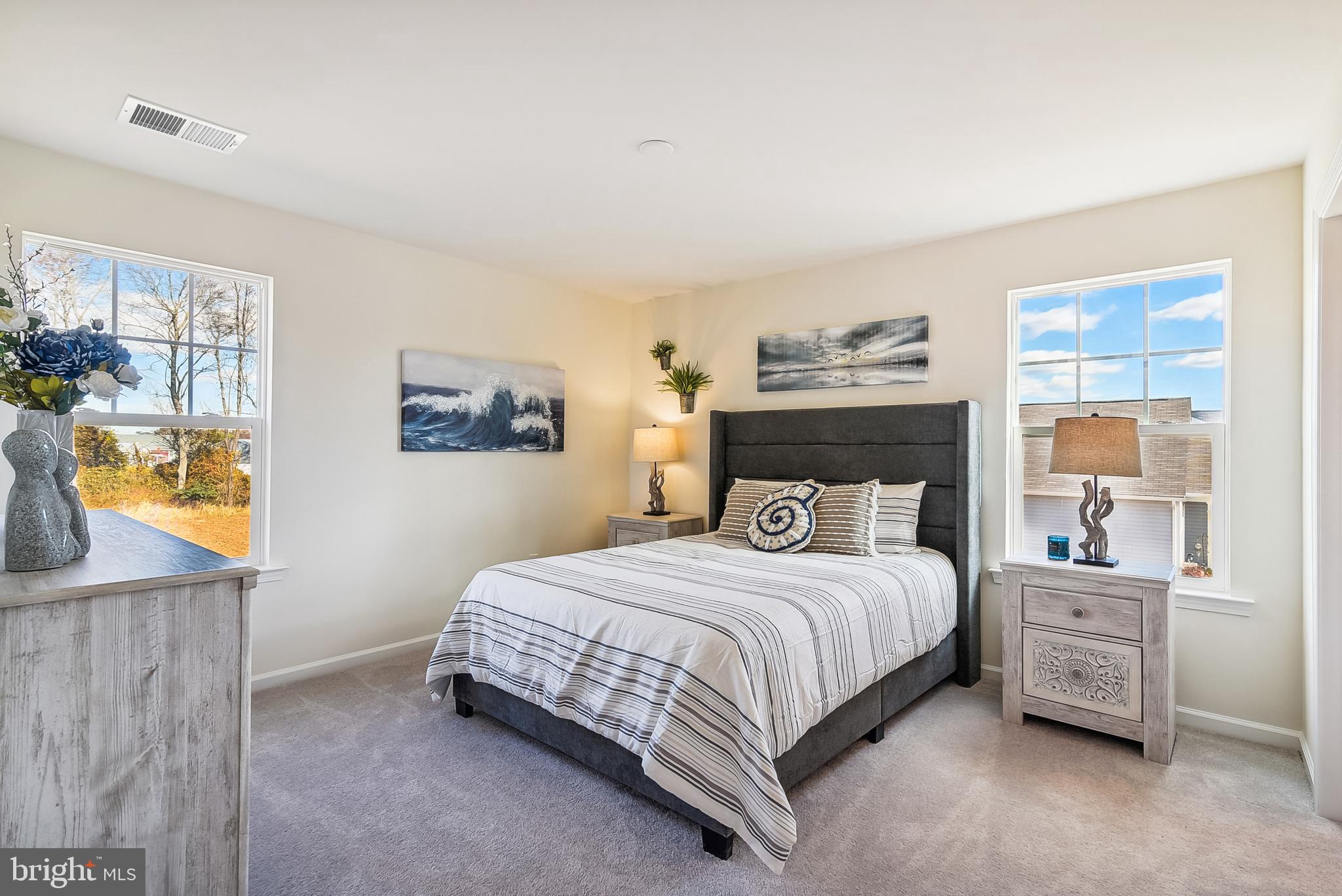 9716 Camp Road Laurel, DE 19956 - Photo 21 of 25 a bedroom with a bed a dresser and next to a window