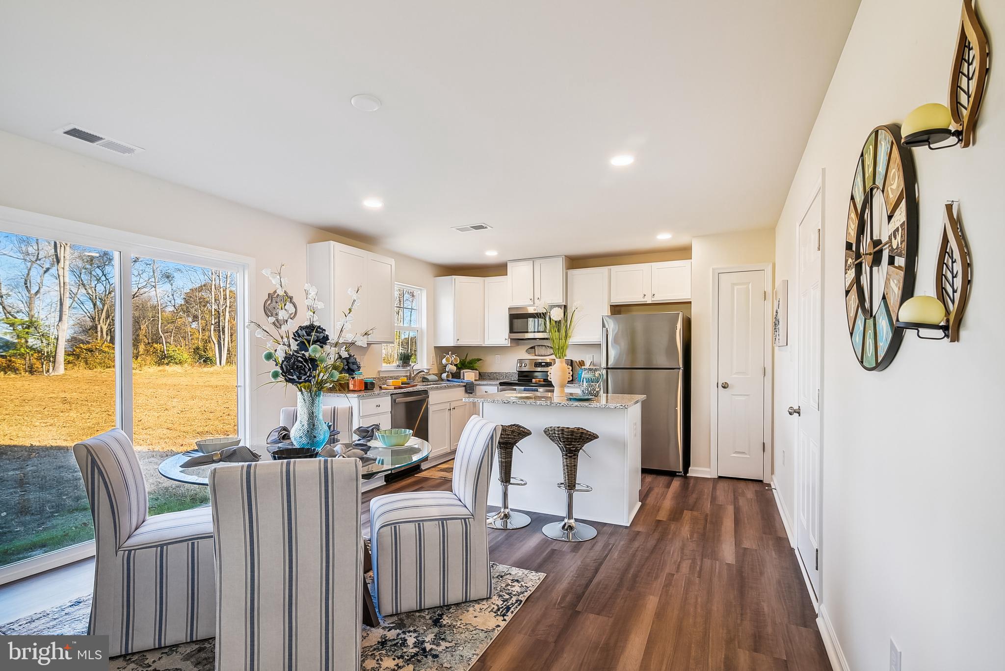 9716 Camp Road Laurel, DE 19956 - Photo 3 of 25 a view of a dining room with furniture window and wooden floor