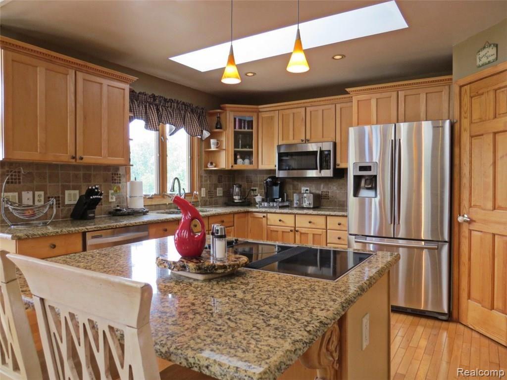 942 South Kern Road Fowlerville, MI 48836 - Photo 17 of 77 Built in Jenn Air cook top that is vented to outside
