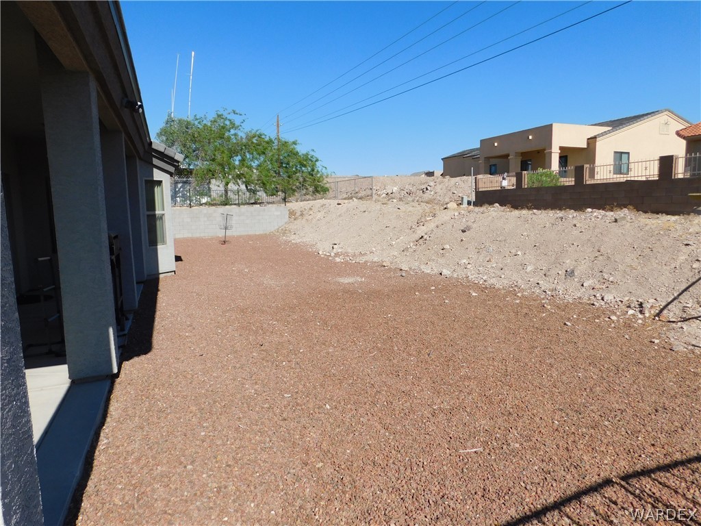 3370 South Ridge Avenue Bullhead City, AZ 86429 - Photo 15 of 56 a view of a house with a snow on the road