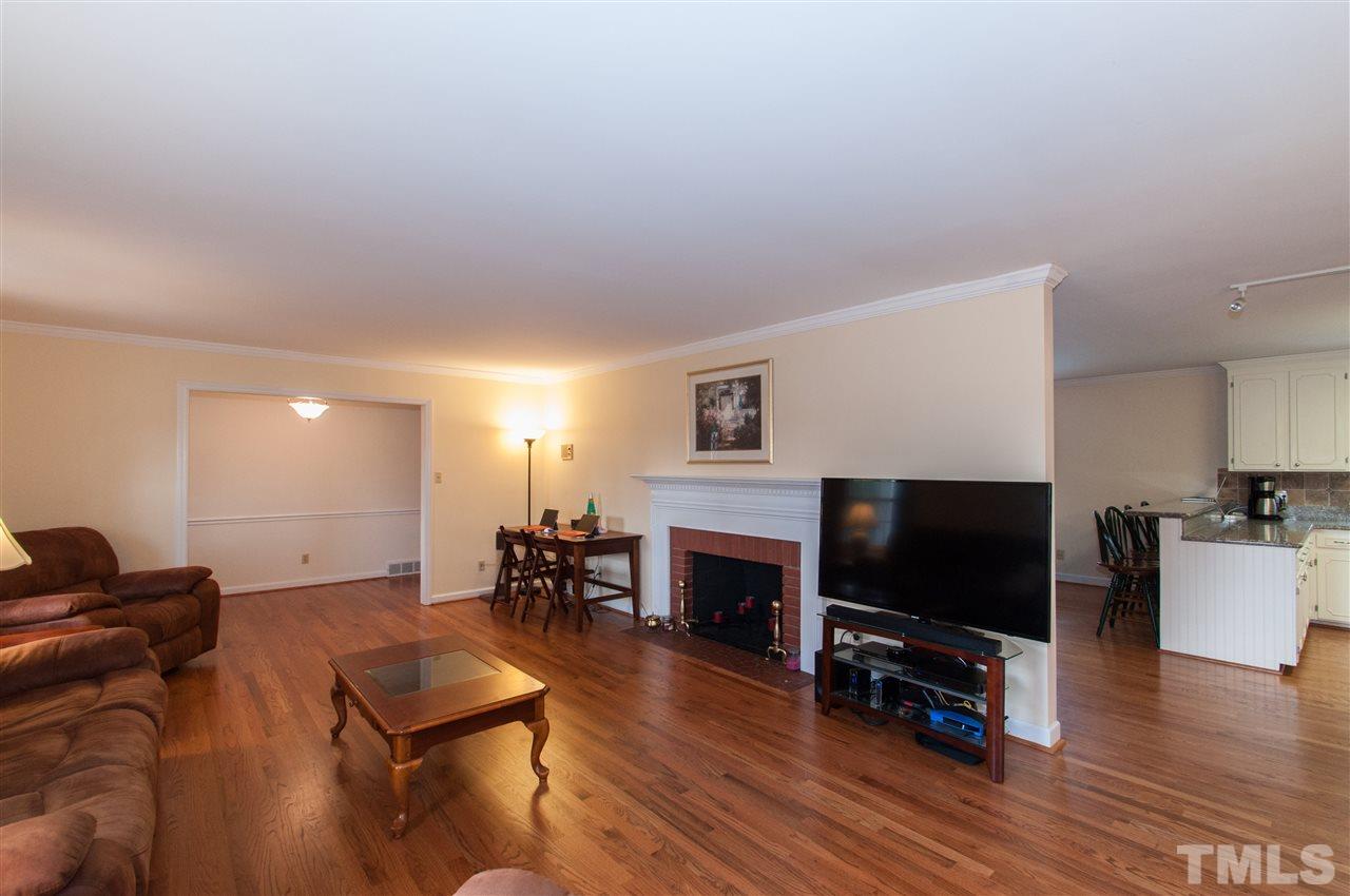 4001 Sue Lane Raleigh, NC 27604 - Photo 4 of 25 a living room with furniture and a flat screen tv