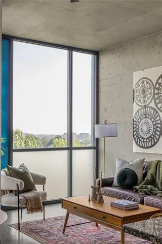 a living room with furniture and a window