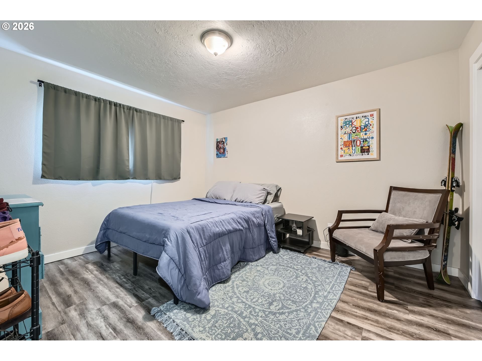 1643 Northeast 74th Avenue Portland, OR 97213 - Photo 11 of 24 a bedroom with a bed and wooden floor