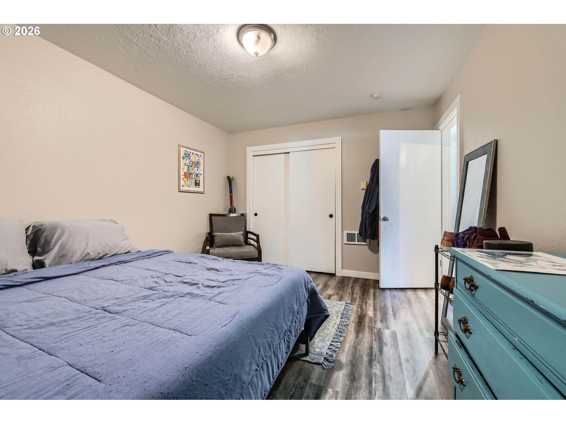 1643 Northeast 74th Avenue Portland, OR 97213 - Photo 12 of 24 a bedroom with a bed and a flat screen tv