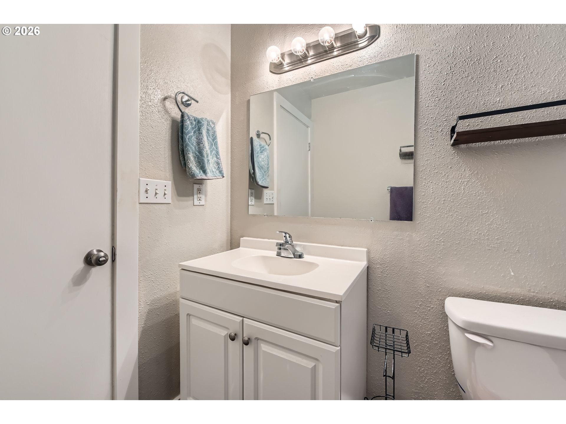 1643 Northeast 74th Avenue Portland, OR 97213 - Photo 14 of 24 a bathroom with a sink toilet and mirror