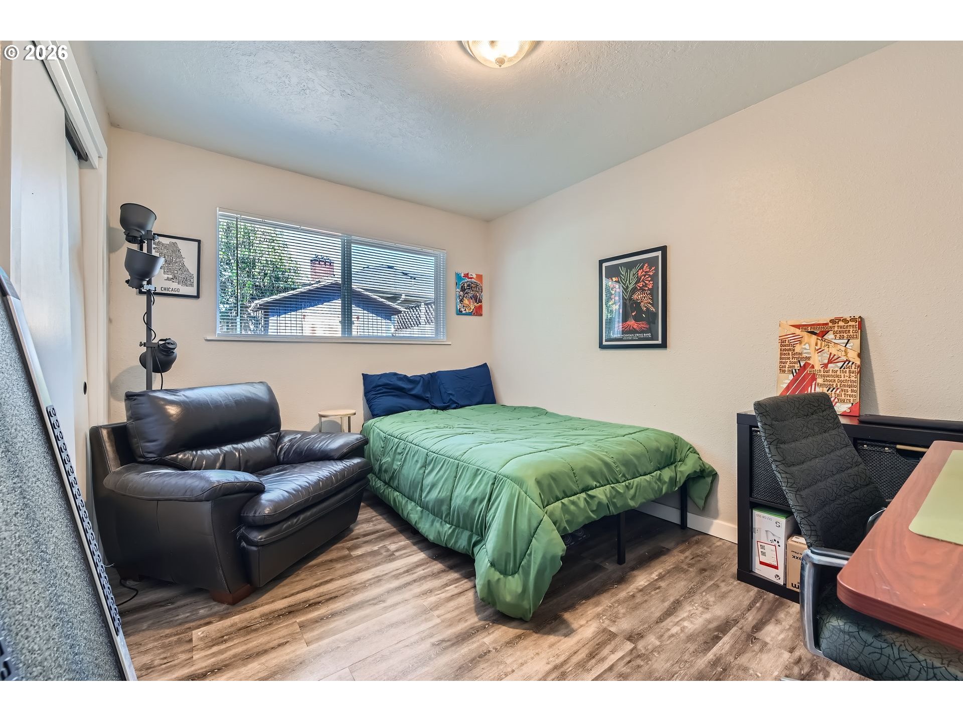 1643 Northeast 74th Avenue Portland, OR 97213 - Photo 15 of 24 a bedroom with a bed and wooden floor