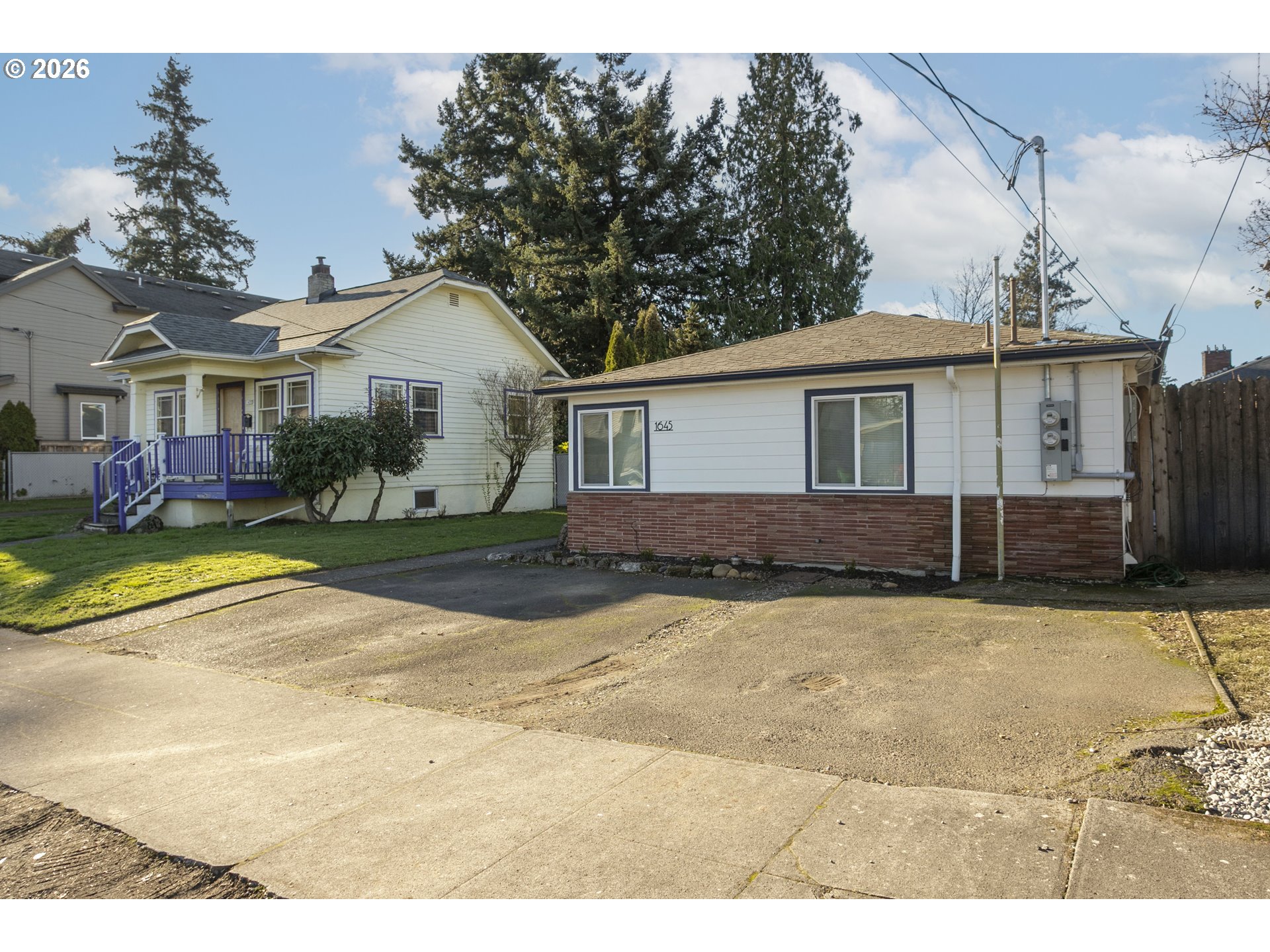 1643 Northeast 74th Avenue Portland, OR 97213 - Photo 3 of 24 a view of a house with snow on the road and yard
