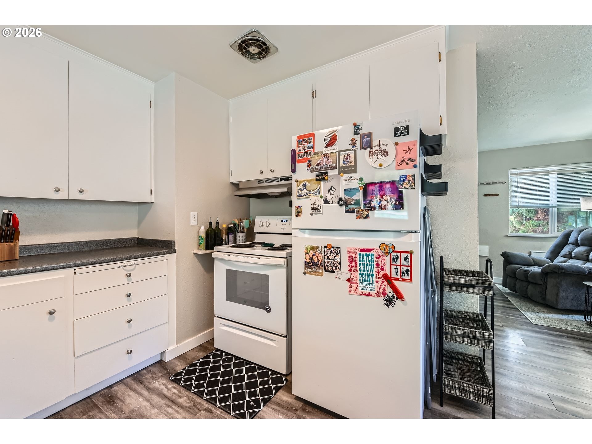 1643 Northeast 74th Avenue Portland, OR 97213 - Photo 10 of 24 a kitchen with a white cabinets and white appliances