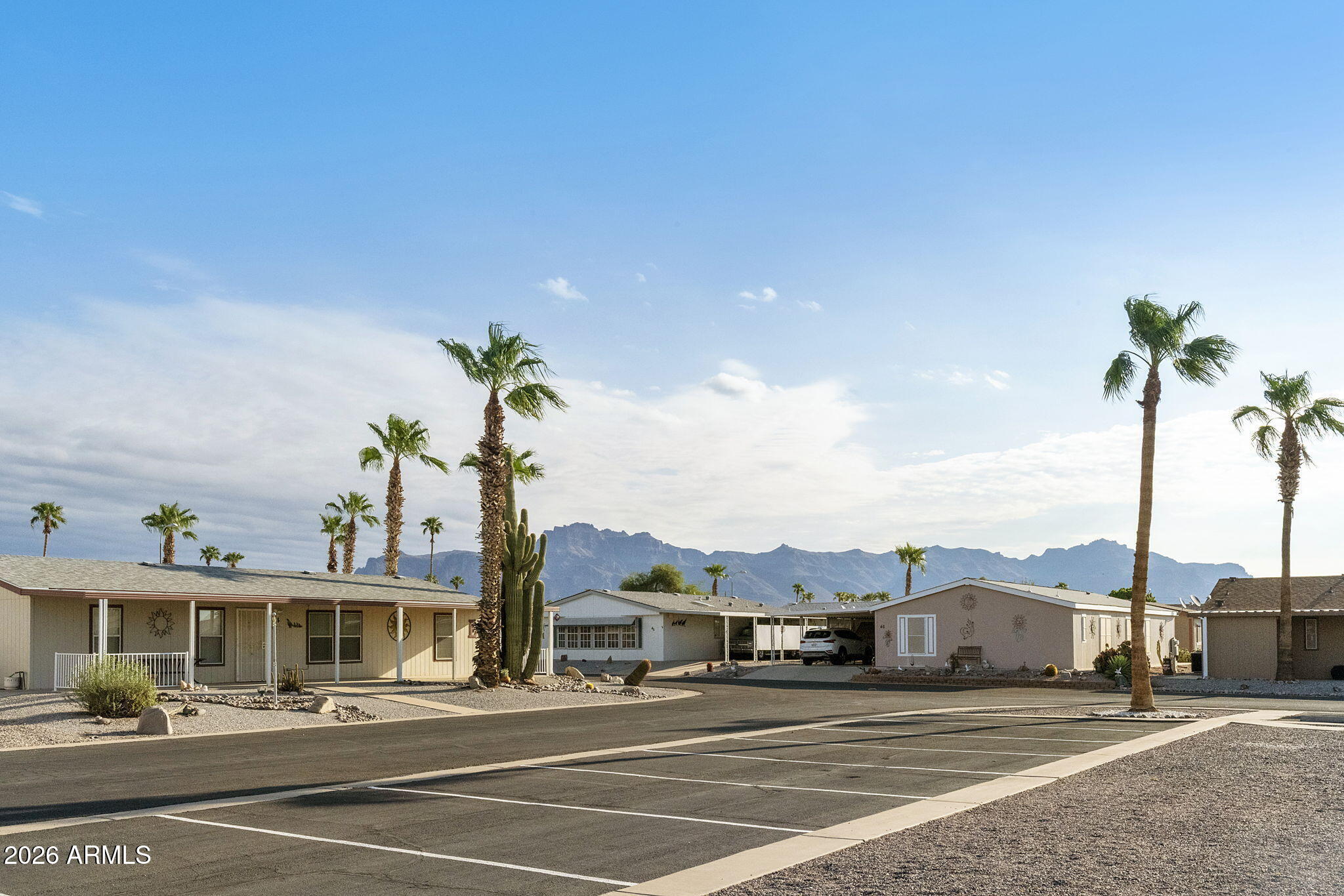 3700 South Tomahawk Road, Unit 73 Apache Junction, AZ 85119 - Photo 49 of 49 a view of a white house with a ocean view