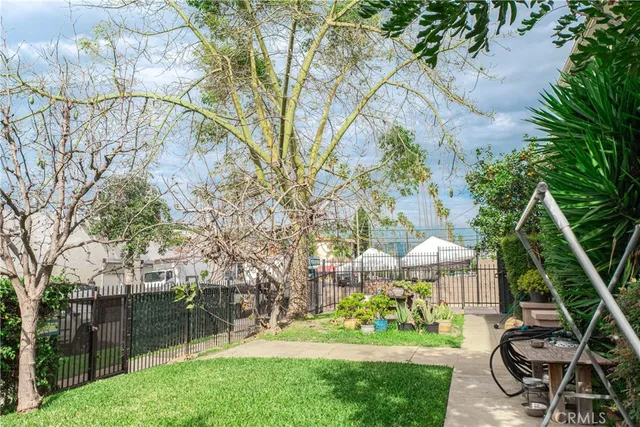 a view of a garden with sitting area