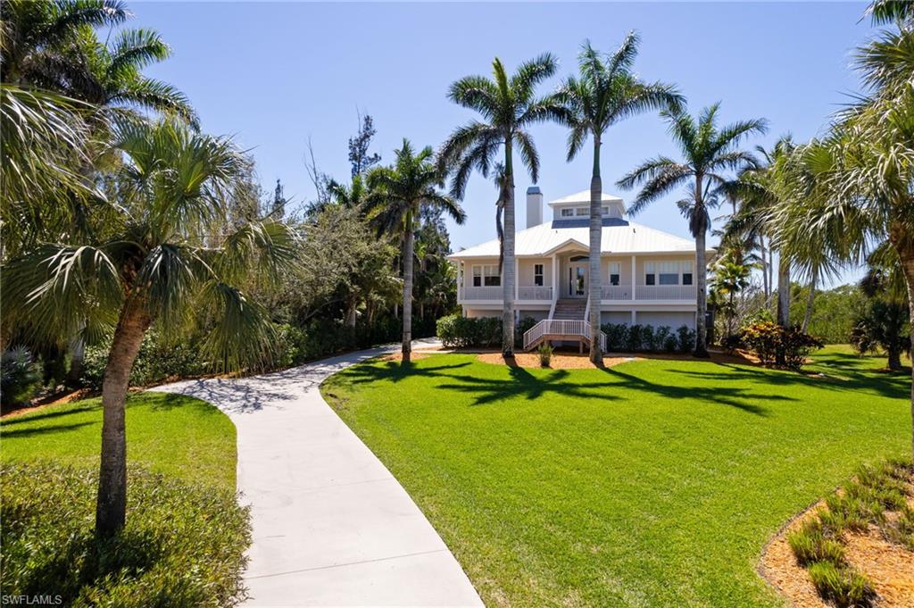 18481 Pioneer Road Fort Myers, FL 33908 - Photo 2 of 44 Long concrete driveway with extra parking