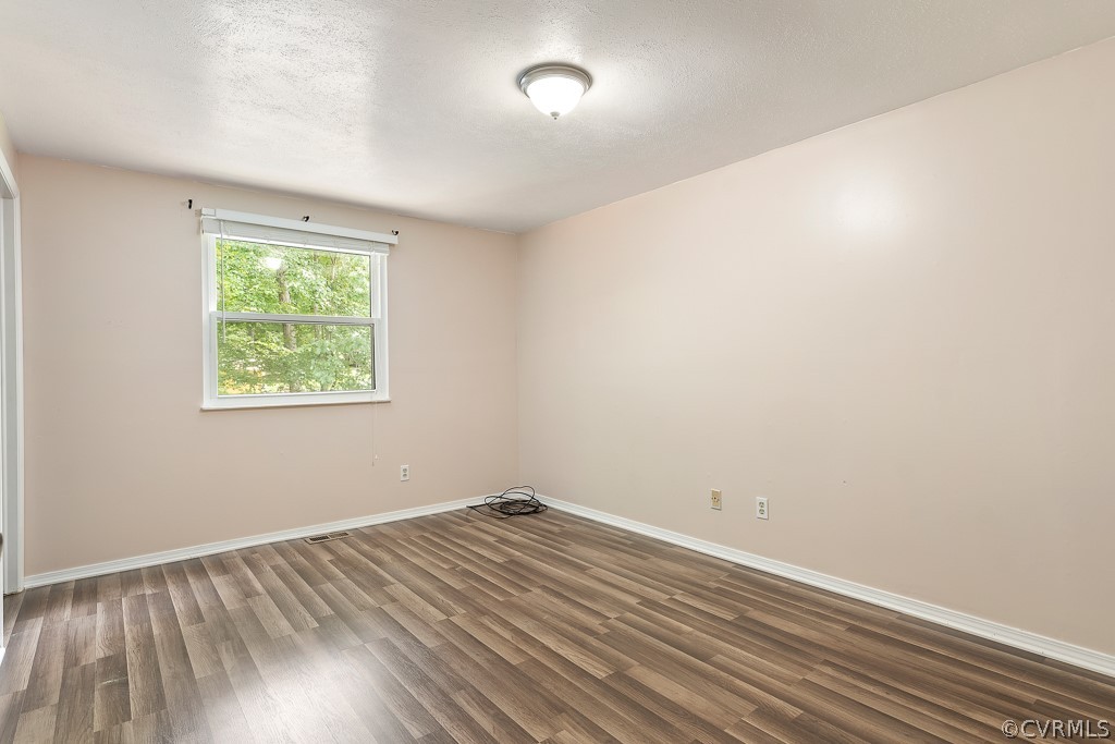 8801 Pepperidge Road North Chesterfield, VA 23236 - Photo 11 of 24 Primary bedroom with NEW laminate floors.