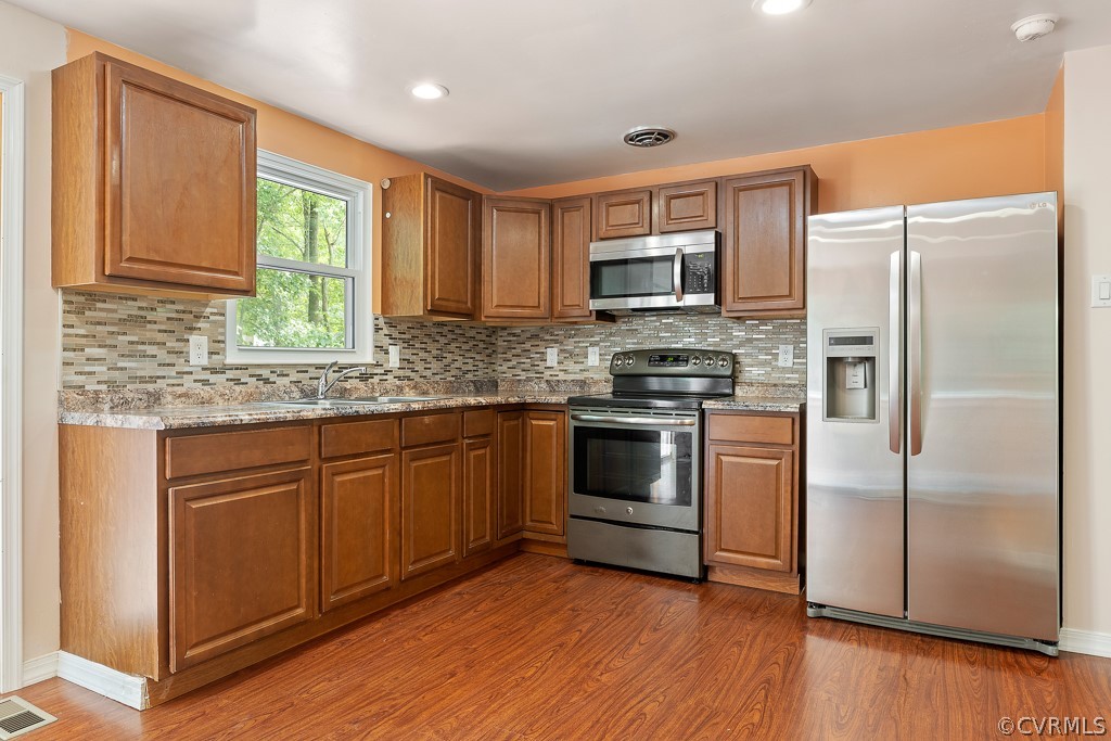 8801 Pepperidge Road North Chesterfield, VA 23236 - Photo 7 of 24 Updated Kitchen with detailed backsplash and fresh