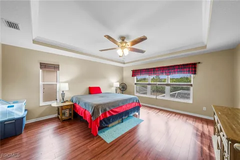 a living room with a bed furniture and a window