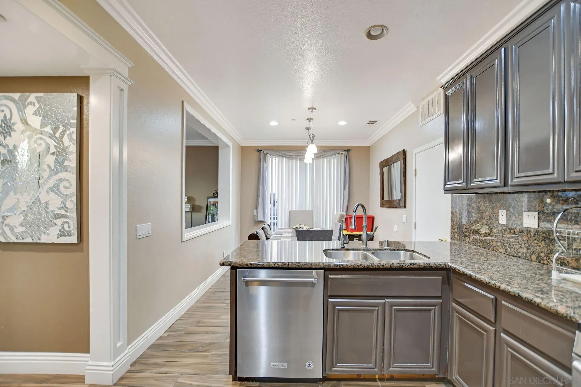 6346 Southern Place Riverside, CA 92504 - Photo 15 of 33 a kitchen with stainless steel appliances granite countertop a sink stove and cabinets