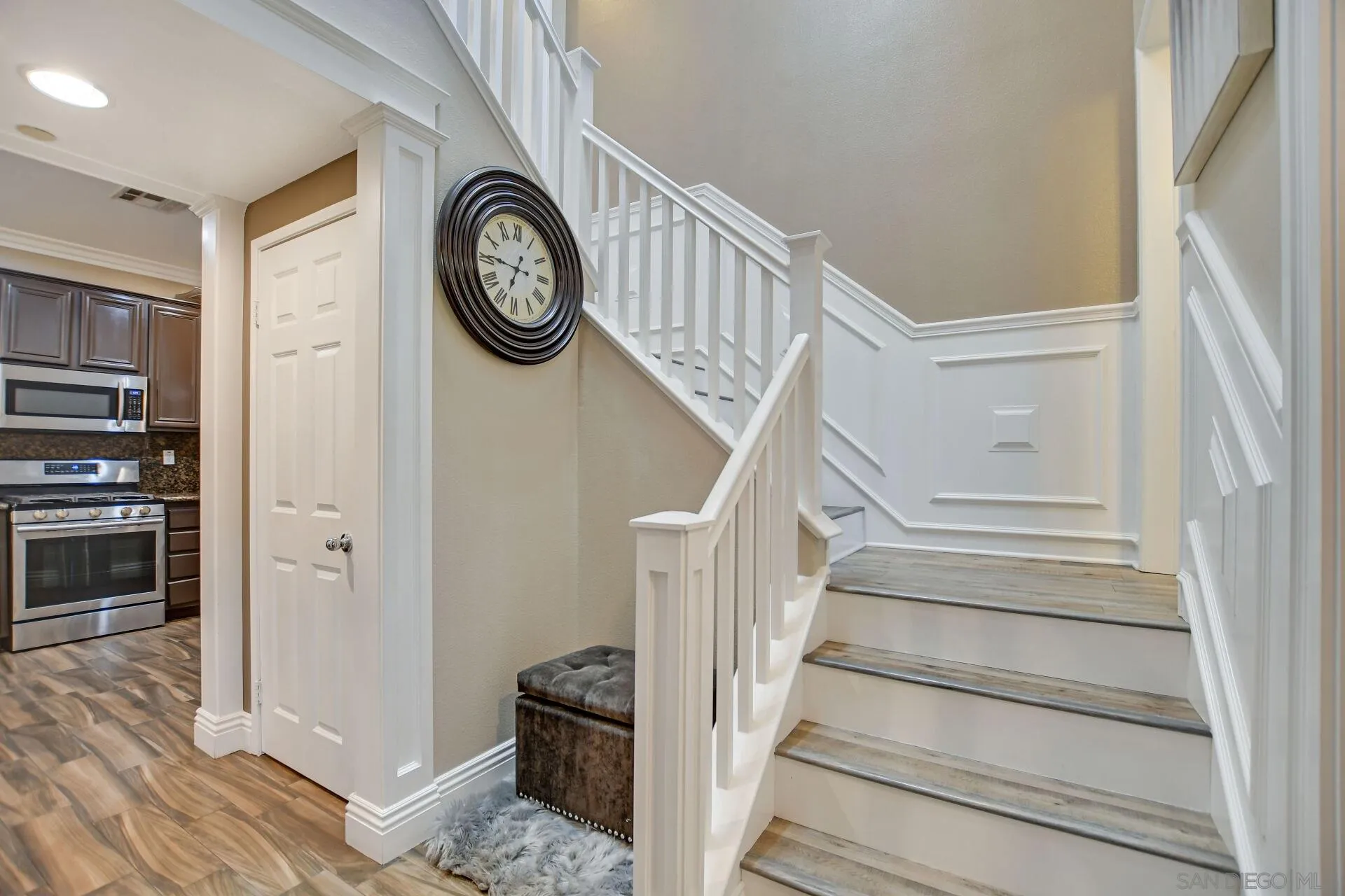 6346 Southern Place Riverside, CA 92504 - Photo 19 of 33 a view of a hallway with wooden floor and a kitchen view