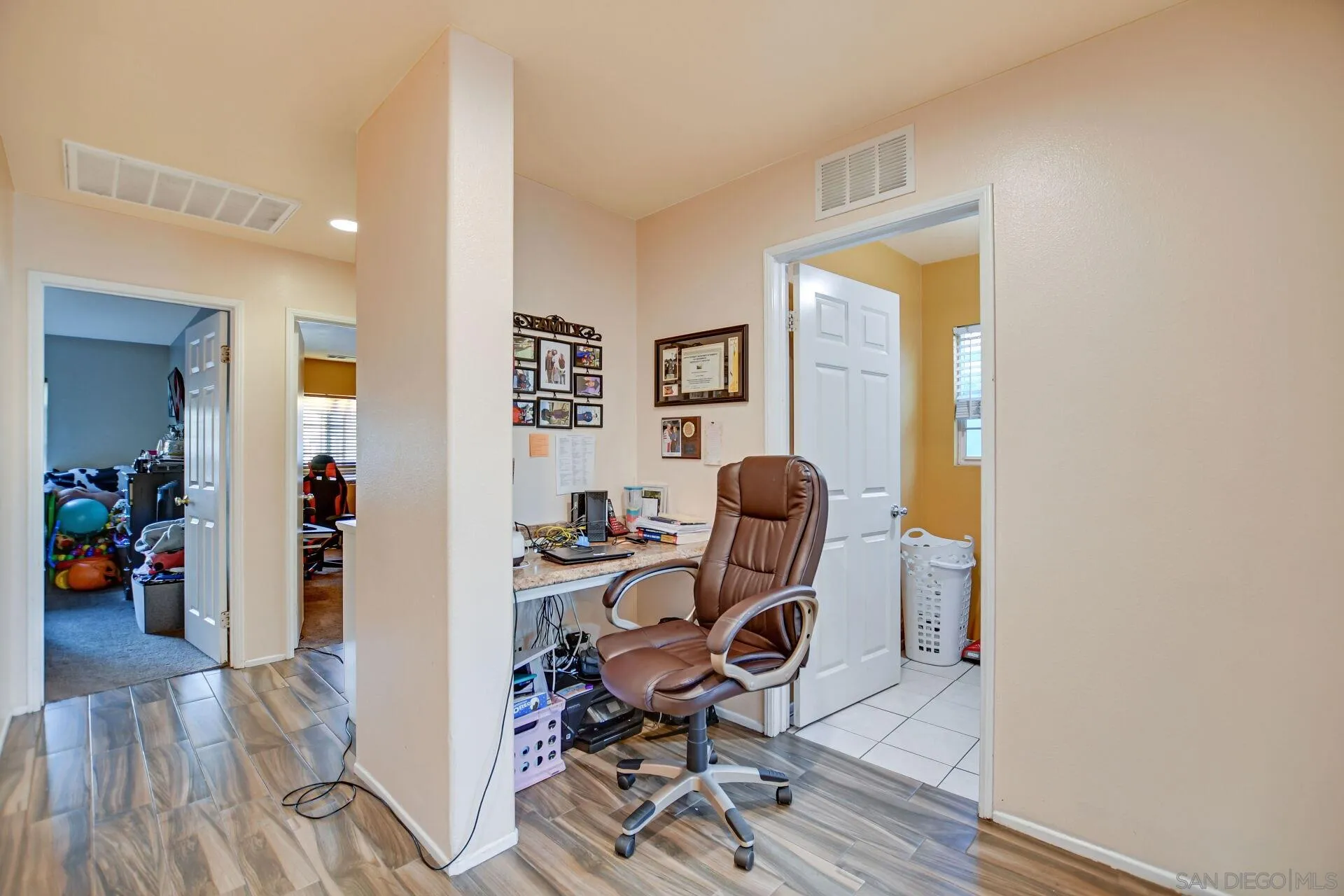 6346 Southern Place Riverside, CA 92504 - Photo 20 of 33 a view of a workspace with furniture and a livingroom