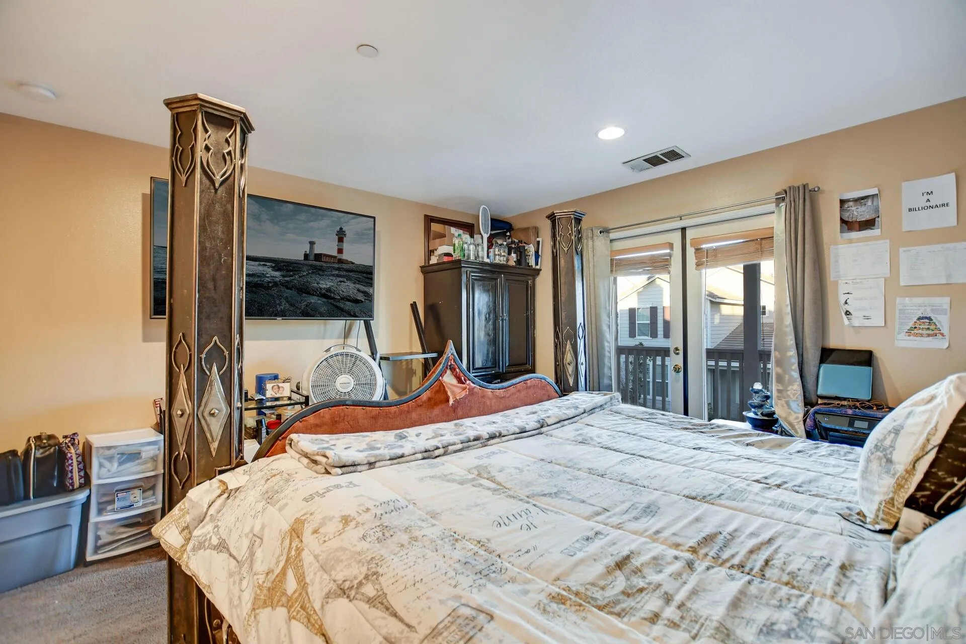6346 Southern Place Riverside, CA 92504 - Photo 24 of 33 a bedroom with a bed and a large mirror with a flat tv screen