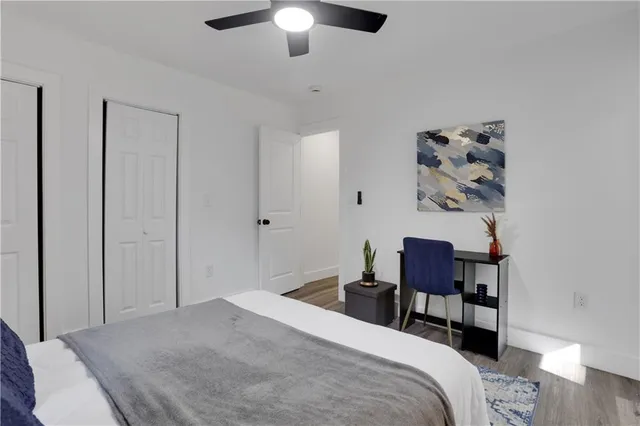 a bedroom with a bed and a chair