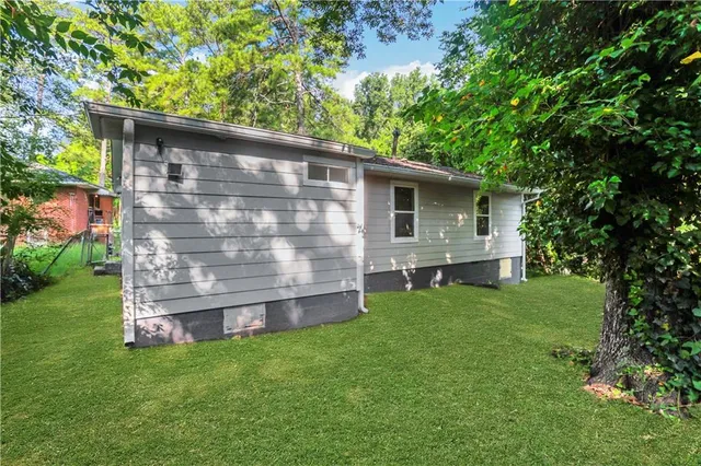 a backyard of a house with lots of green space