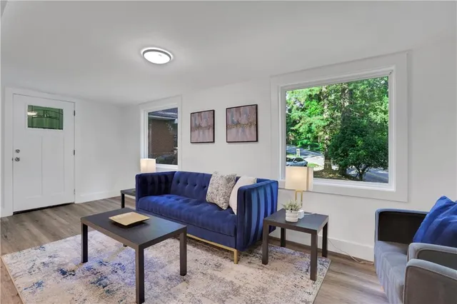 a living room with furniture and a window