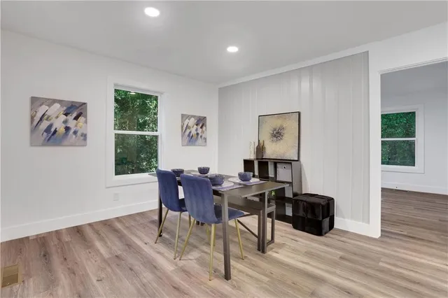 a view of a livingroom with furniture and wooden floor