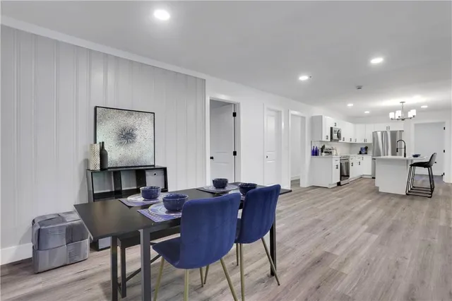 a view of a dining room with furniture and wooden floor