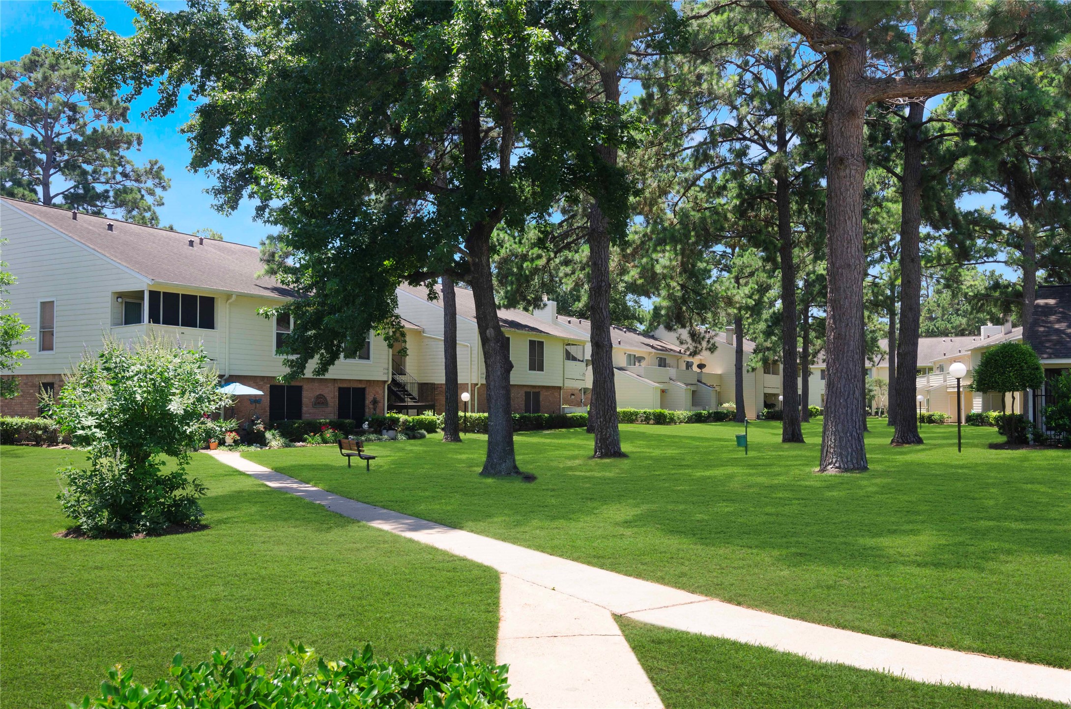 14555 Wunderlich Drive, Unit 2902 Houston, TX 77069 - Photo 1 of 33 a view of a house with a big yard with large trees
