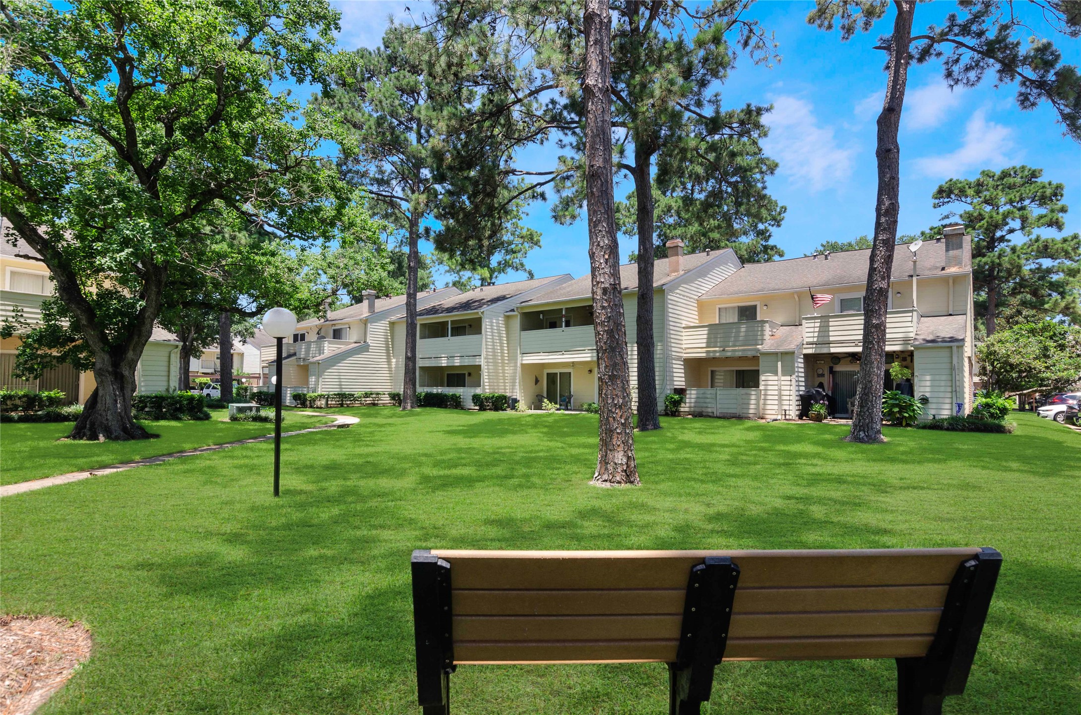 14555 Wunderlich Drive, Unit 2902 Houston, TX 77069 - Photo 31 of 33 a view of a chair and table in the garden
