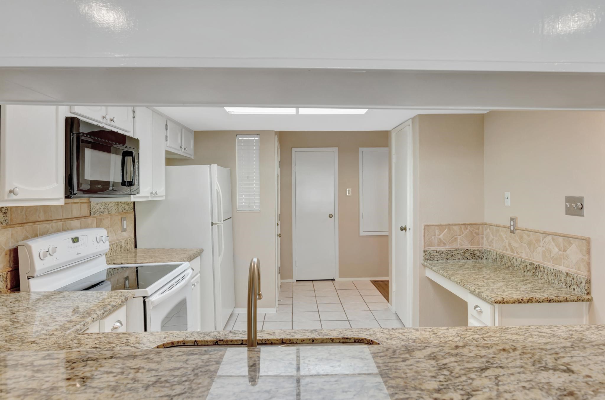 14555 Wunderlich Drive, Unit 2902 Houston, TX 77069 - Photo 8 of 33 a spacious bathroom with a granite countertop sink and a mirror