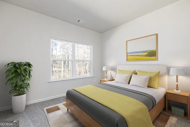 a bedroom with a bed and a potted plant