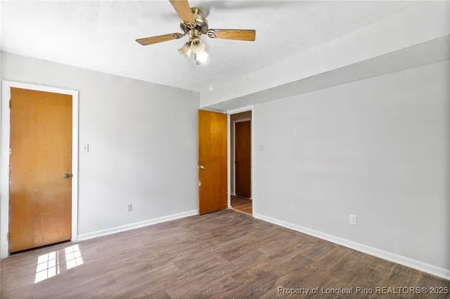 a view of a house with a yard and tree s