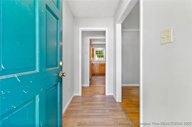 a view of a bathroom from the hallway