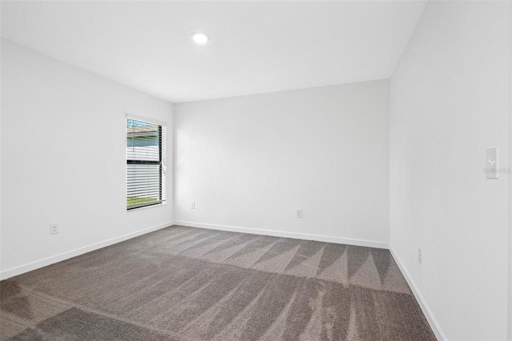 11308 Linnet Road Weeki Wachee, FL 34614 - Photo 6 of 8 an empty room with a workspace