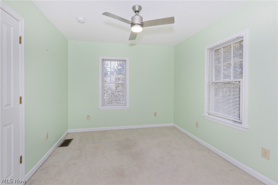 917 Brunswick Road Cleveland Heights, OH 44112 - Photo 24 of 42 Bedroom one with closet, ceiling fan and great natural light.